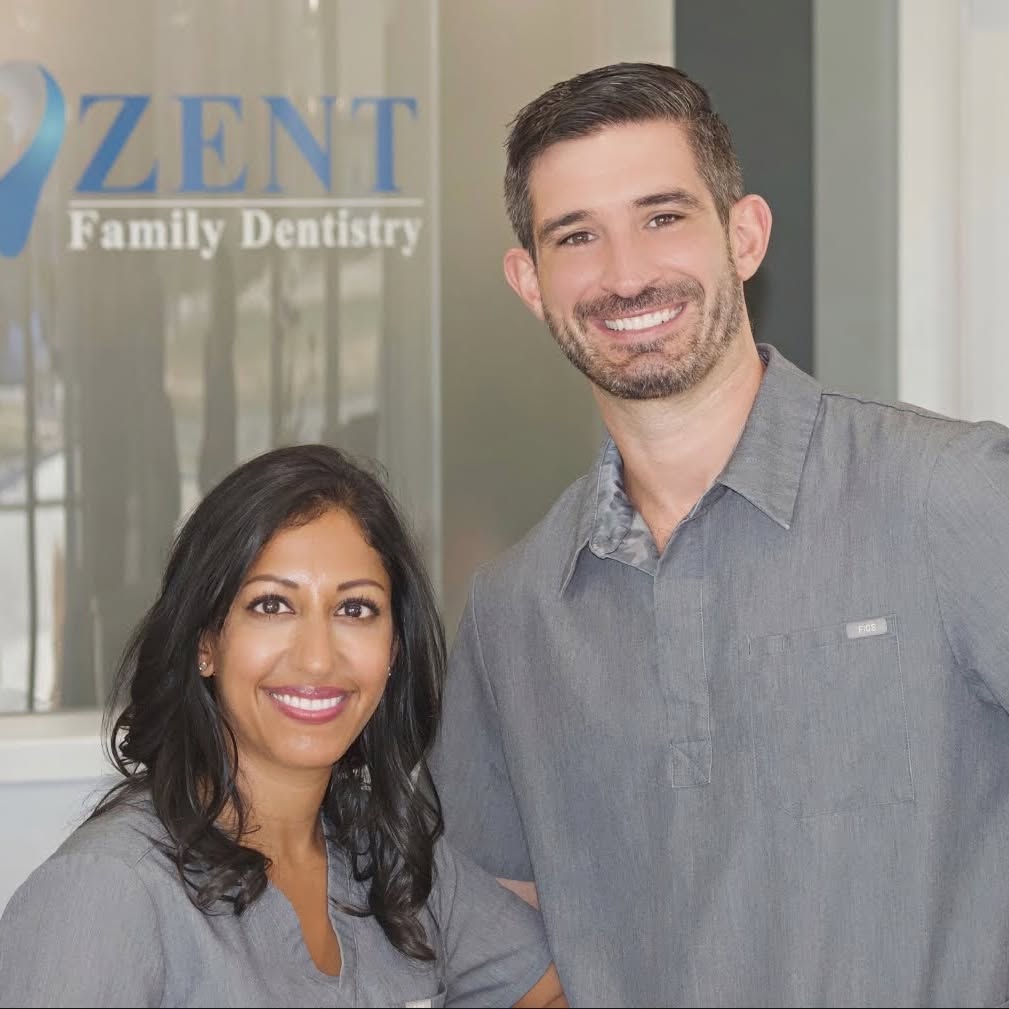 Drs. Sheena and Stephen Zent smiling together in their South Bend office